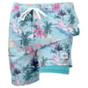 Light blue swim trunks with a tropical print featuring palm trees, flowers, pineapples, sailboats, and a white drawstring waistband.