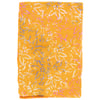 A folded piece of orange fabric featuring a floral leaf pattern in white, pink, and purple.