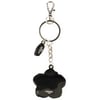 A metal flower-shaped keychain with a metal chain, keyring, lobster clasp, and a small tag attached.