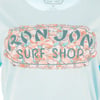 A light blue shirt with a colorful, seashell-patterned graphic that reads RON JON SURF SHOP.