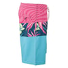 Colorful board shorts featuring a pink zigzag pattern, floral design on a dark blue background, and solid turquoise lower section. Zippered pocket on the upper back side and a drawstring waist.