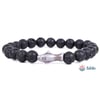 A stretch bracelet with round black lava beads and a shark-shaped bead in the center, displayed on a white background with the Fahlo logo in the corner.