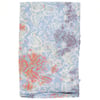 A folded piece of light blue fabric with a batik pattern in white, orange, and purple leaf and floral shapes.