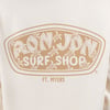 Off white shirt with Ron Jon Surf Shop logo and Ft. Myers text, featuring turtle illustrations in the background of the logo.