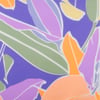 A colorful abstract pattern featuring overlapping leaves and shapes in purple, orange, green, and yellow tones.
