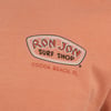 Close-up of an orange fabric with the Ron Jon Surf Shop logo and text Cocoa Beach, FL.