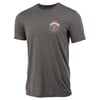 Gray T-shirt with a small circular emblem on the left chest featuring a graphic and text. The shirt has short sleeves and a crew neckline.