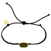 Black cord bracelet with an adjustable knot and a central gold-tone metal plate. A small round gold charm is attached near the knot.