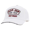 A white baseball cap with Ron Jon Surf Shop Key West embroidered on the front and Ron Jon Surf Shop printed on the underside of the brim.