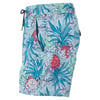Colorful swim trunks with a tropical pattern featuring pineapples and flowers, green drawstring waistband, and a circular logo label near the hem.