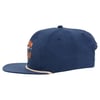 A blue baseball cap with a flat bill and a rope detail above the brim. The front of the cap has embroidered text and designs.