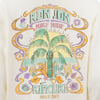 Vintage-style graphic depicting a tropical beach scene with a palm tree, flowers, and the words Ron Jon Surf Shop Rip Curl Since 1969 in pastel colors.