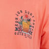 Illustration on a coral shirt featuring a person lounging on a drink with flowers and a sun. Text reads Ron Jon Surf Shop Quiksilver.