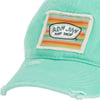 A mint green cap with a slightly frayed patch featuring a colorful striped background and the text Ron Jon Surf Shop.