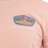 Close-up of a peach t-shirt featuring a Ron Jon Surf Shop logo and Long Beach Island, NJ text on the front.
