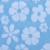 Blue fabric with a pattern of white flowers, including various sizes of daisy-like shapes, on a textured background.