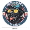 Illustration of a black dog wearing sunglasses and a blue cap with Ron Jon Surf Shop logo, surrounded by text Cocoa Beach Florida 1925. A measurement below reads 3.5 Inches.