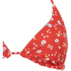 Close-up of the top part of a red triangle bikini with small white flowers and thin straps.