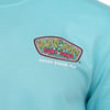 Close-up of a turquoise-colored shirt featuring the Ron Jon Surf Shop logo and Cocoa Beach, Fla printed on the chest.