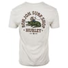 White t-shirt with a graphic of a man riding an alligator, decorated with Ron Jon Surf Shop and Hurley Est. 1999 text.