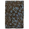 A piece of brown fabric with a repeating pattern of light blue and gray leafy branches.