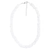 A white shell necklace with irregular, flat shell pieces and a silver adjustable chain clasp.