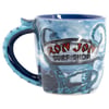 Blue coffee mug with a handle shaped like a tentacle, featuring a Ron Jon Surf Shop sign and ocean-themed design with more tentacles.