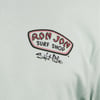 A close-up of a light-colored shirt featuring the Ron Jon Surf Shop logo above the words Salt Life in stylized text.