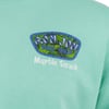 Close-up of a mint green shirt with a Ron Jon Surf Shop Myrtle Beach logo on the chest.