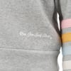 Gray sweatshirt with Ron Jon Surf Shop text on the front and colorful stripes on the sleeve.