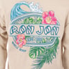 Sand colored shirt featuring a Ron Jon Surf Shop Myrtle Beach logo with a wave, pink flowers, and green tropical leaves.