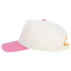 A white baseball cap with a pink brim and a gold adjustable strap is shown from the side.