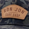 10841250000-ron-jon-black-camo-opticam-trucker-hat-front-detail.jpg