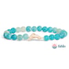 Beaded bracelet with turquoise and white crackle beads, featuring a central dolphin charm; Fahlo logo in the lower right corner.