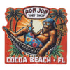 Illustration of a relaxed orangutan in a hammock with a drink, wearing sunglasses and a bucket hat, under palm trees. Text: Ron Jon Surf Shop, Cocoa Beach, FL.