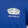 Close-up of a royal blue shirt featuring the Ron Jon Surf Shop logo and Cocoa Beach, Fla text on the chest.