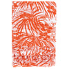Orange and white sarong with a tropical leaf pattern and fringed edges.