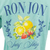 Mint shirt with Ron Jon Surf Shop text and illustration of lemon, orange, and strawberries surrounded by leaves and blue flowers.