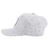 Side view of a light gray baseball cap with a tropical pattern featuring fish and palm trees, and a circular patch on the front.