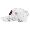 White baseball cap with palm tree and bird pattern, featuring a brown patch on the side.