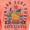 T-shirt with Ron Jon Surf Shop Quiksilver text, featuring a tropical design with a woman sitting on a drink, surrounded by flowers and fruit, under a stylized sun.