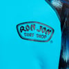 Close-up of a blue shirt with a Ron Jon Surf Shop logo printed in black on the front.