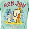A cartoon dog holds a surfboard labeled Ron Jon in its paw, with sharks swimming nearby and puppie love written below on a green shirt.