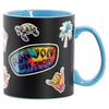 A black mug with a blue interior and handle, decorated with colorful Ron Jon Surf Shop logo and various tropical-themed stickers, including a turtle, palm tree, and shaka sign.