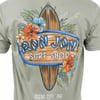 Back of a shirt featuring a surfboard design with tropical flowers and the text Ron Jon Surf Shop and Ocean City, MD.