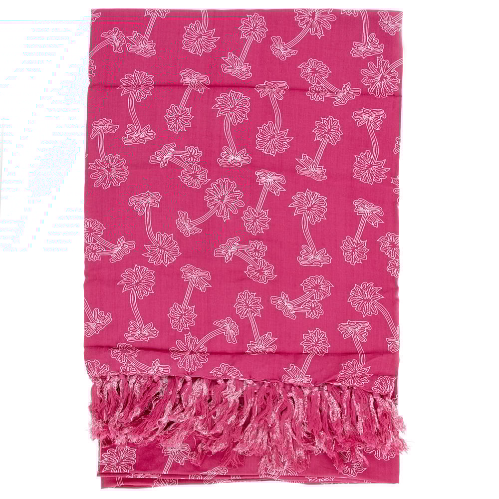 A pink scarf with white palm tree patterns and fringe detailing at one end, laid flat against a white background.