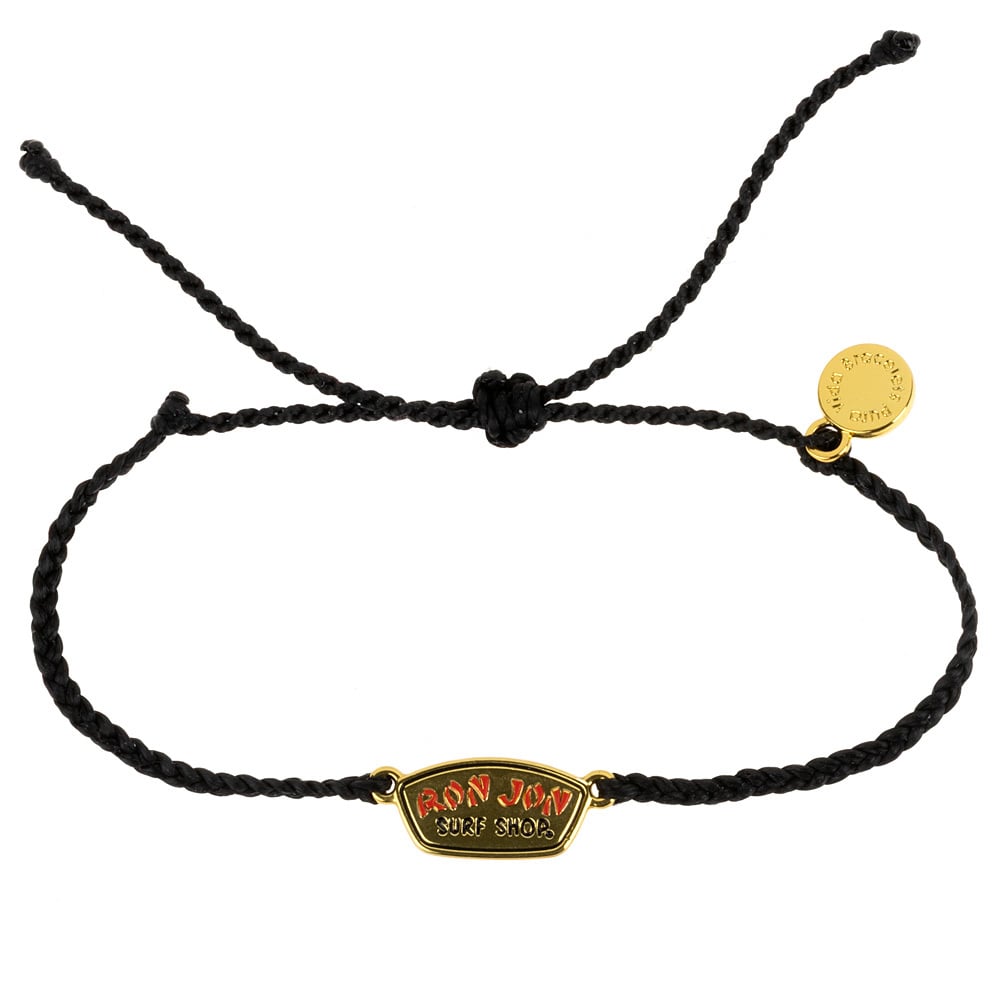 Black braided bracelet with a small gold and red Ron Jon Surf Shop charm and an additional small gold round charm on the side.