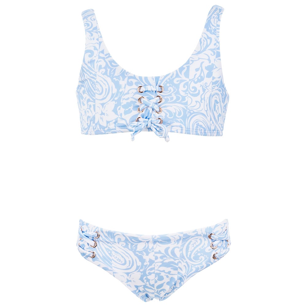 Light blue and white floral bikini with lace-up detail on the top and sides of the bottoms, against a plain white background.