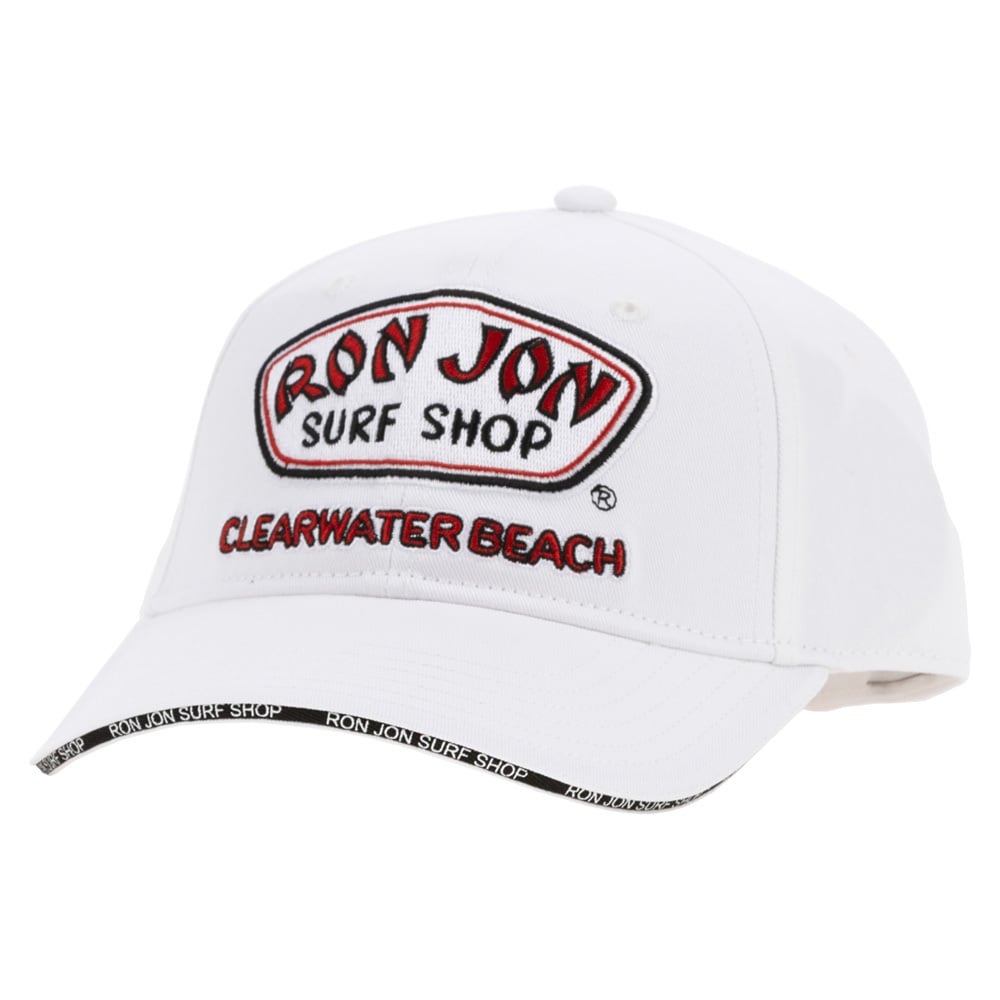 A white baseball cap with a Ron Jon Surf Shop Clearwater Beach embroidered logo on the front and Ron Jon Surf Shop text along the edge of the brim.