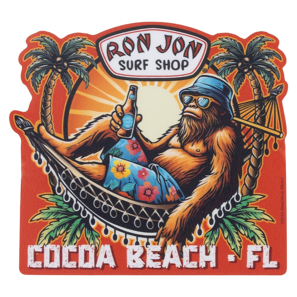 Illustration of a relaxed orangutan in a hammock with a drink, wearing sunglasses and a bucket hat, under palm trees. Text: Ron Jon Surf Shop, Cocoa Beach, FL.